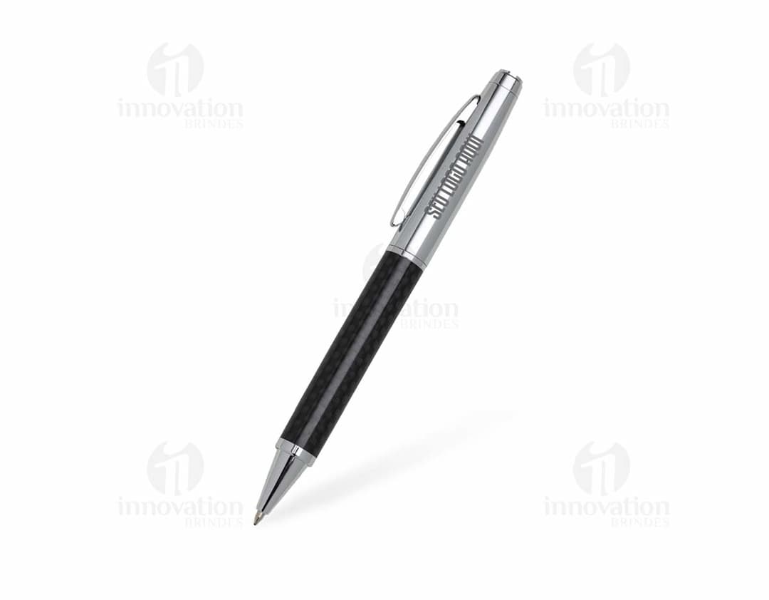 Caneta Metal prateada sobre um papel branco, utilizada para escrever e assinar documentos.