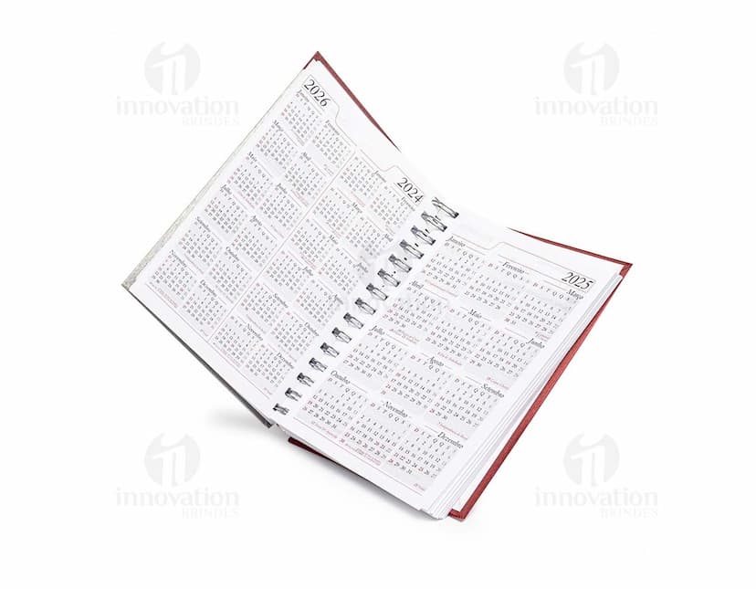 Agenda Diária 2025 com capa preta, espiral, espaço para escrever notas, listas e compromissos, design moderno, feita em metal e papel, ideal para organizar o dia a dia no trabalho, na escola ou em reuniões de negócios.