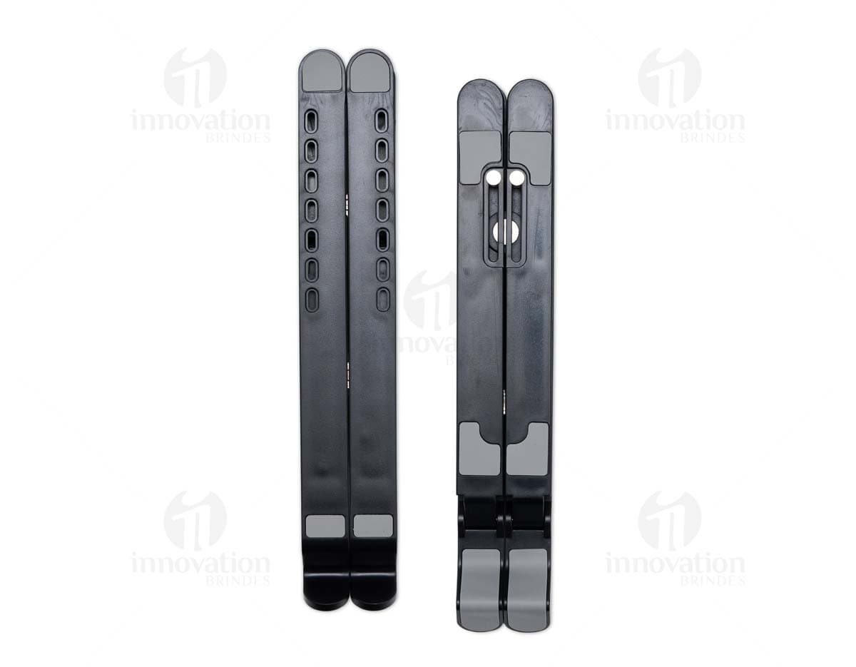 Suporte retrátil para notebook em metal prateado, design industrial e tecnológico. Inclui suporte, assento, Equipamento eletrônico e dispositivo de comunicação.