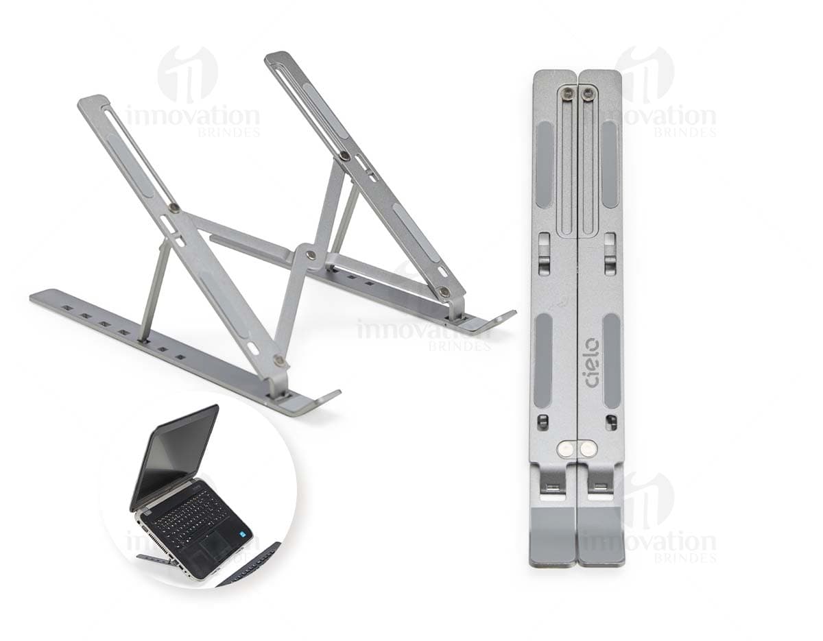Suporte retrátil para notebook feito de metal e aço, sendo uma ferramenta tecnológica e moderna para facilitar o uso do dispositivo.