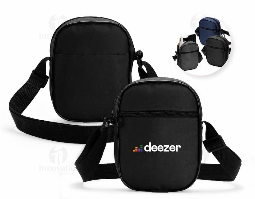 Bolsa de ombro de poliéster preta com alça de couro, fecho metálico, equipada com bolso interno e design moderno. Ideal para viagens e uso diário.