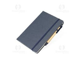Rice fiber notebook with pen on a white background. The notebook is light brown with black details on the cover. The pen is