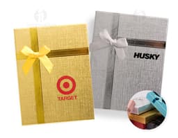 Red gift box with a golden bow and small shiny details.