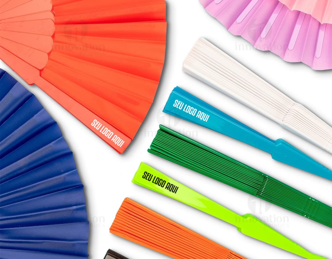 Colorful plastic fan with a modern and shiny design. The fan features geometric shapes in shades of yellow, orange, violet