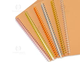 Kraft notebook with a white kraft paper design, inside an empty cardboard envelope. The notebook is open showing blank pages.