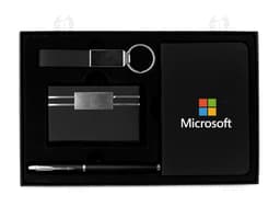 Kit Executivo 4 Peças em preto e amarelo, com ícones de notebook, diskette, ícone de pasta e ícone de mensagem em destaque.