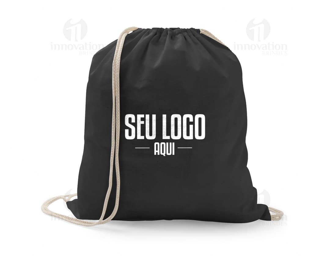 Happy man using a black leather backpack tote bag for travel. The modern and stylish accessory features an adjustable strap