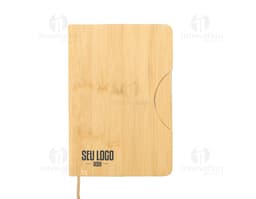 Notebook with phone holder in pink with an elastic to secure the phone on the front cover.