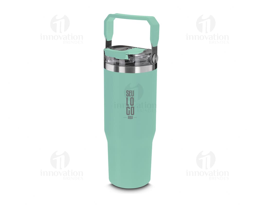 Red thermal water bottle with a screw-on lid and carrying handle. The bottle is on a wooden table, and in the background, a