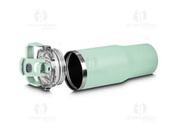 Red thermal water bottle with a screw-on lid and carrying handle. The bottle is on a wooden table, and in the background, a