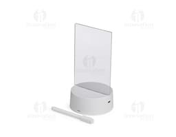 Luminária Led de Mesa na cor preta, com hastes flexíveis e base redonda. Acesa, iluminando um ambiente com luz branca.
