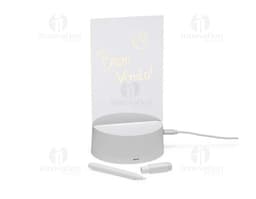 Luminária Led de Mesa na cor preta, com hastes flexíveis e base redonda. Acesa, iluminando um ambiente com luz branca.