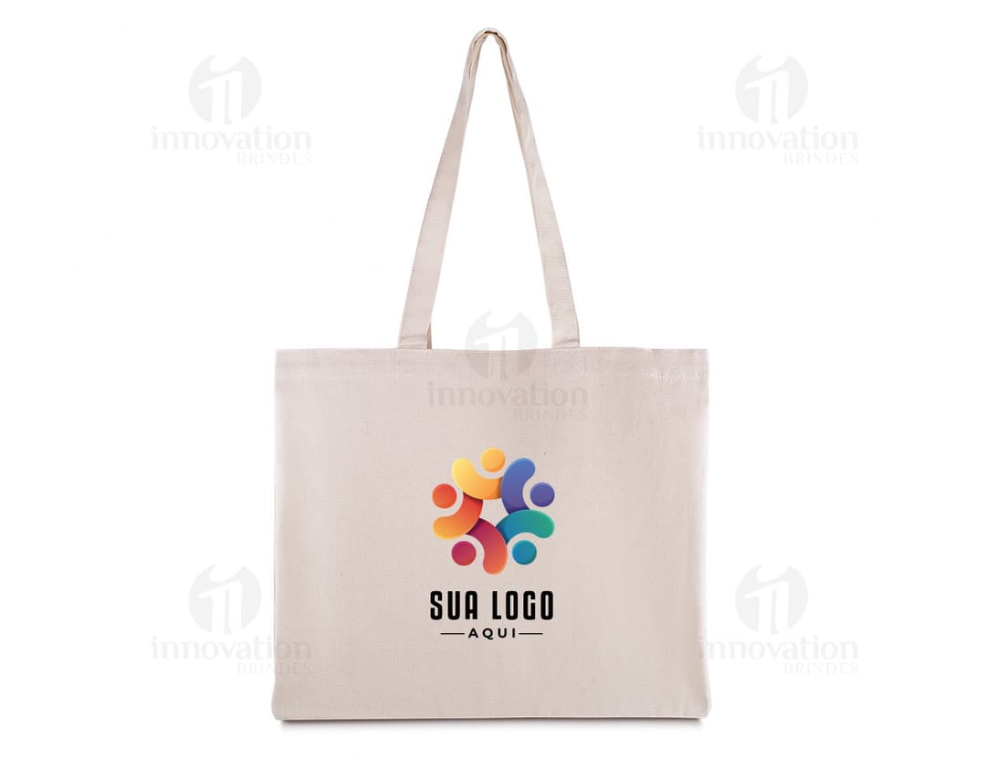 Pink cotton tote bag, empty, with handles and elegant design. Targeted towards a female audience, perfect for shopping in