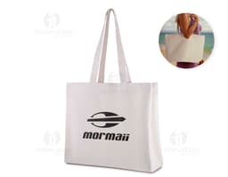 Pink cotton tote bag, empty, with handles and elegant design. Targeted towards a female audience, perfect for shopping in