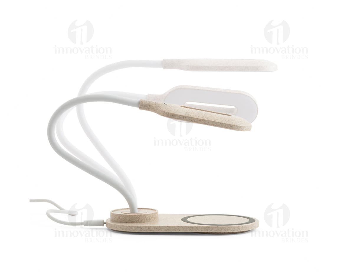 Luminária de mesa flexível com 12 LEDs em uma superfície branca. Luminária de mesa flexível com 12 LEDs em uma superfície branca.