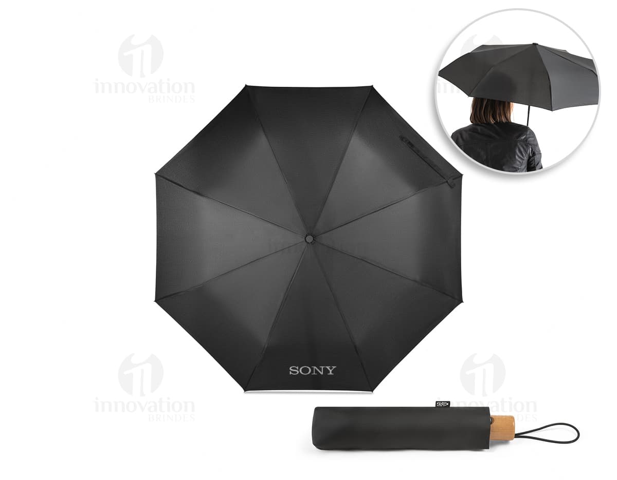 Guarda-chuva reversível nas cores azul e verde, com estampa de flores e folhas. Guarda-chuva reversível nas cores azul e verde, com estampa de flores e folhas.