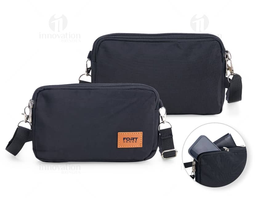 Bolsa térmica dobrável em cor azul-marinho, com detalhes em cinza e alça ajustável. Mostra a bolsa fechada e compacta, ideal para transporte de alimentos e bebidas.